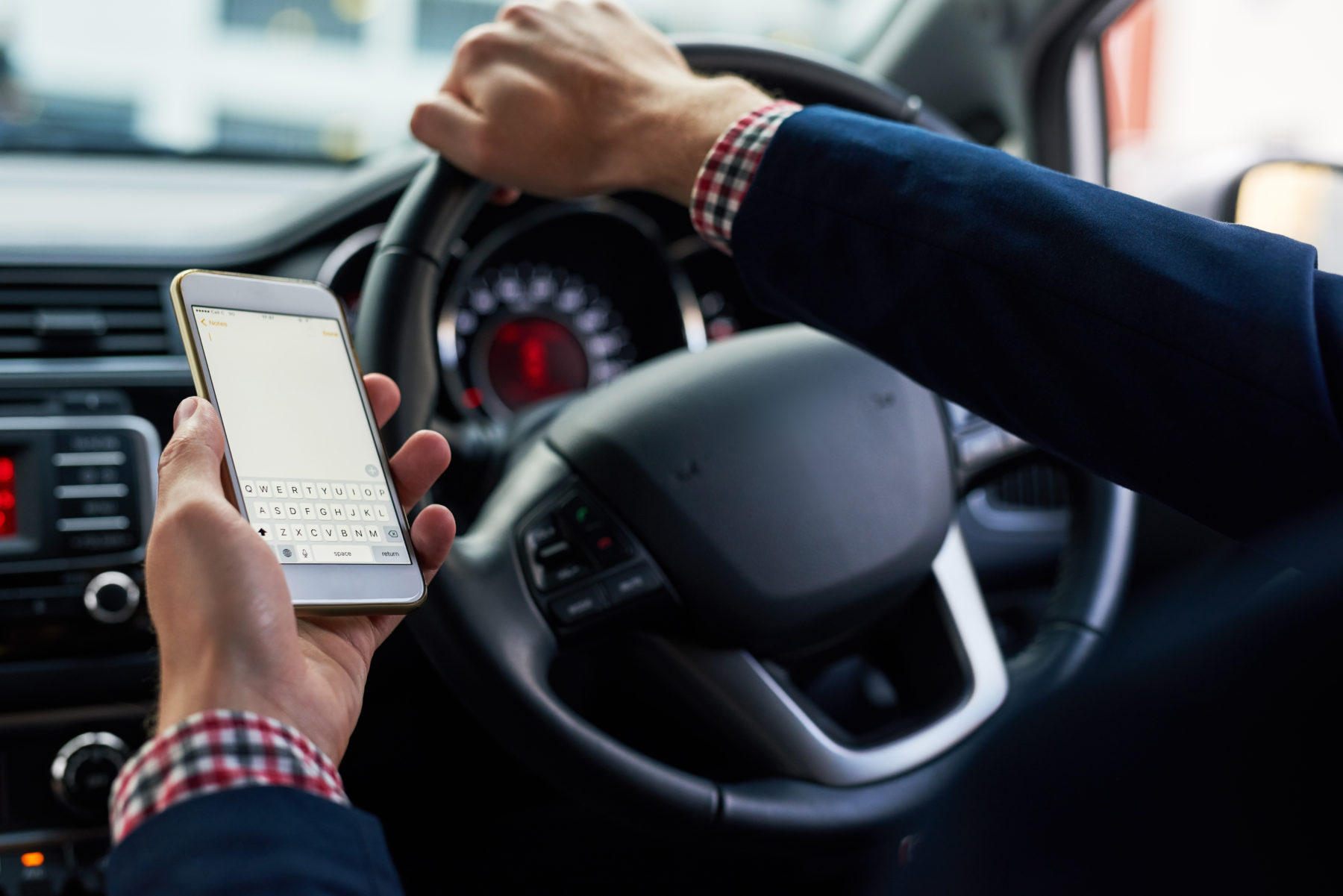Distracted driving has become an 'epidemic,' new report suggests